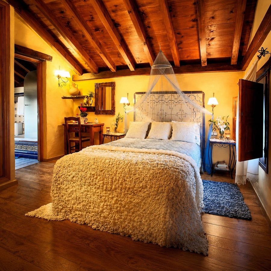 Rustic bedroom at The Ridge accommodation near Pizarra, Málaga